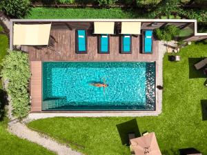 Bazén v ubytování Dolomit Boutique Hotel nebo v jeho okolí
