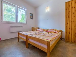 Postel nebo postele na pokoji v ubytování Apartments Ksenija