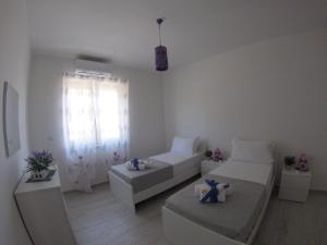 Posteľ alebo postele v izbe v ubytovaní Oudeis Holidays Apartments Tropea