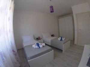 Posteľ alebo postele v izbe v ubytovaní Oudeis Holidays Apartments Tropea