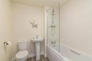 a bathroom with a toilet and a sink and a shower at Blackstone Walk - Fabulous Houses with Parking in Nottingham +66 photos