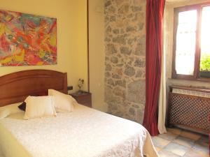 Postel nebo postele na pokoji v ubytování Hostal Rural Elosta