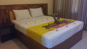 Ένα ή περισσότερα κρεβάτια σε δωμάτιο στο Intan Inn Hostel