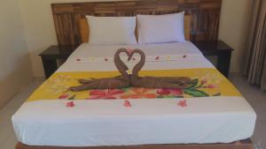 Ένα ή περισσότερα κρεβάτια σε δωμάτιο στο Intan Inn Hostel