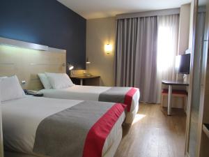 Postel nebo postele na pokoji v ubytování Holiday Inn Express Málaga Airport by IHG