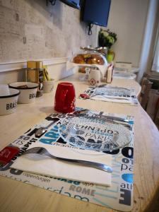 a table topped with lots of kitchen supplies at Landlord in Trastevere in Rome