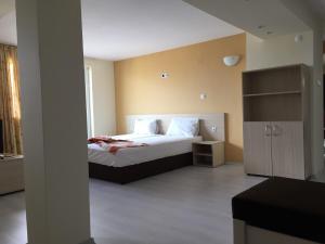 A bed or beds in a room at Aparthotel Lucky Family