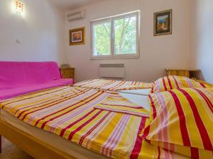 Postel nebo postele na pokoji v ubytování Apartments Ksenija