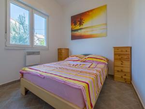 Postel nebo postele na pokoji v ubytování Apartments Ksenija