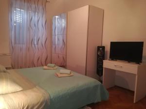 Voodi või voodid majutusasutuse Rooms Šećer toas