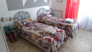 Postel nebo postele na pokoji v ubytování B&B Il MappaMondo