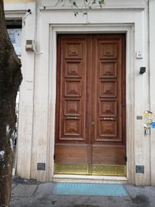 a door leading to a room with a door open at Landlord in Trastevere in Rome