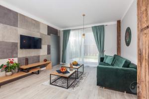 Telewizja i/lub zestaw kina domowego w obiekcie Apartament Natura I