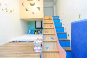 Postel nebo postele na pokoji v ubytování Yilan Dongshan Cypress B&B