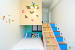 Postel nebo postele na pokoji v ubytování Yilan Dongshan Cypress B&B