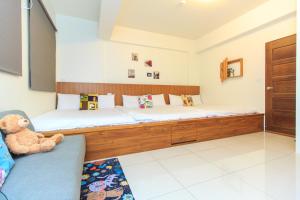 Postel nebo postele na pokoji v ubytování Yilan Dongshan Cypress B&B