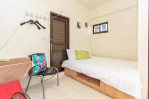 Postel nebo postele na pokoji v ubytování Yilan Dongshan Cypress B&B