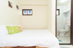 Postel nebo postele na pokoji v ubytování Yilan Dongshan Cypress B&B