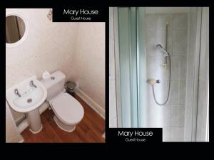 a bathroom with a toilet and a shower and a sink at Mary House 46 in Porthcawl