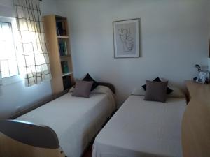 Postel nebo postele na pokoji v ubytování Dunas villa + 32 fotografií