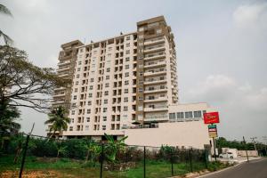 a large white building on the side of a street at HummingBird Holiday Apartment in Galle