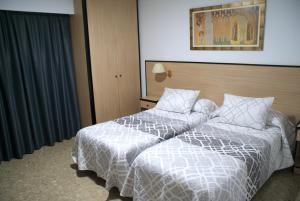 Postel nebo postele na pokoji v ubytování Hotel Carabela 2