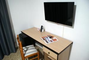 TV a/nebo společenská místnost v ubytování Hotel Carabela 2
