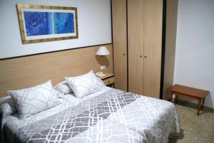 Postel nebo postele na pokoji v ubytování Hotel Carabela 2