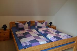 En eller flere senge i et værelse på Haus Simone