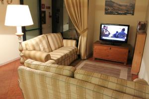 TV a/nebo společenská místnost v ubytování Hotel Belvedere Dolomiti