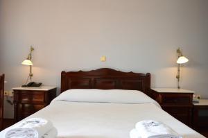 Postelja oz. postelje v sobi nastanitve Ilion Hotel