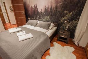 Posteľ alebo postele v izbe v ubytovaní ApartSerwis - Apartament Zacisze