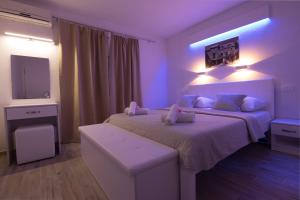 Postel nebo postele na pokoji v ubytování Apartments Family Roso