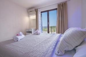 Postel nebo postele na pokoji v ubytování Apartments Family Roso