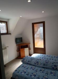 Ένα ή περισσότερα κρεβάτια σε δωμάτιο στο Pastravaria Romani