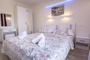 Postel nebo postele na pokoji v ubytování Apartments Family Roso