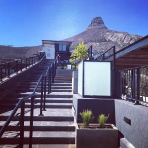 a set of stairs with a mountain in the background at Heart of the Cape.. in Cape Town