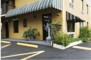 a store front of a building with a window at Cabarrus Inn in Concord +8 photos