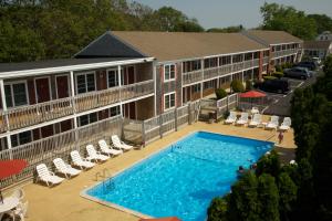 an aerial view of a hotel with a swimming pool at Holiday Hill Inn & Suites in Dennis Port