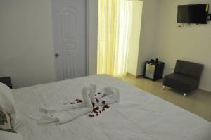 Postel nebo postele na pokoji v ubytování Hostal San Francisco de Asis