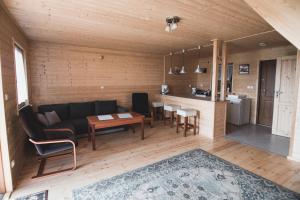 a living room with a couch and a table at Trzy Kolory Jezierzany in Jezierzany