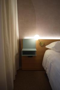 Postel nebo postele na pokoji v ubytování Garden Hotel