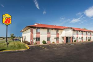 a large building with a parking lot in front of it at Super 8 by Wyndham Eau Claire I-94 in Eau Claire