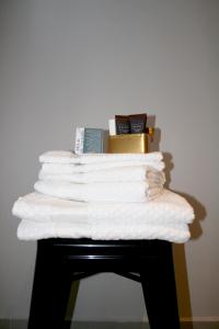 a stack of towels on top of a table at B&B Rocambola in Nogara +47 photos