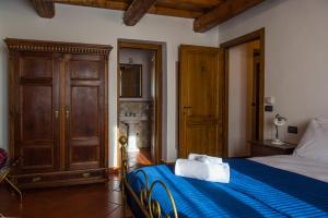 Postel nebo postele na pokoji v ubytování B&B I Pini Di Storaco
