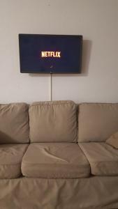 ametix sign on the wall above a couch at Apartamento Tibi - centro de Gandia in Gandía