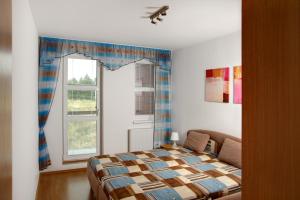 Postel nebo postele na pokoji v ubytování Apartmány KLÍNOVEC - Apartment KEILBERG