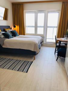 Posteľ alebo postele v izbe v ubytovaní AQUAMARINA ONYX GOLD