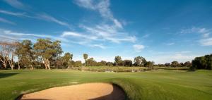a view of a golf green with a bunker at Bridges on Meninya Motel & Apartments in Moama