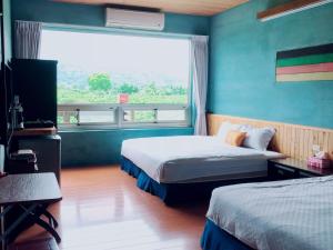 Postel nebo postele na pokoji v ubytování Ying Tian Ye Homestay